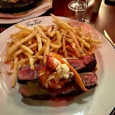 Tiny Lou's signature dishes Steak Frites
Crepe Cake
Lobster Risotto